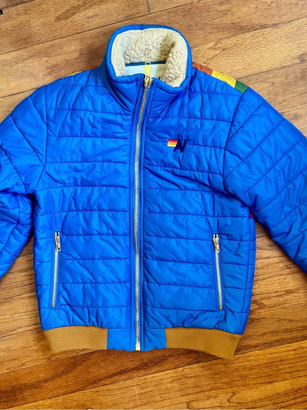 Aviator Nation Blue Puffer Jacket with Rainbow Sunburst - Picture 2 of 4